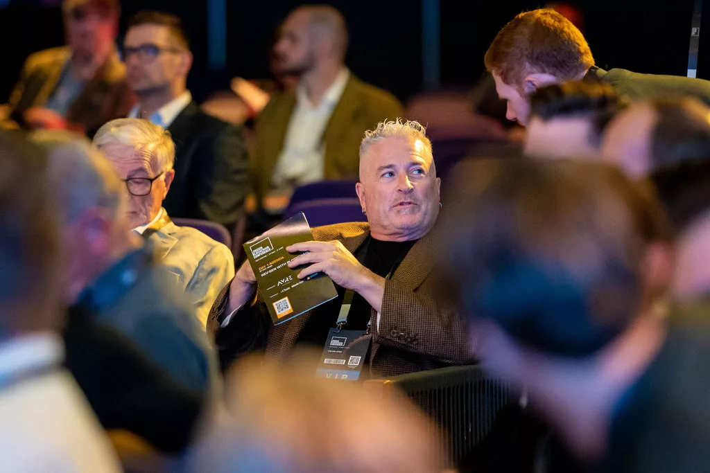 Calvin Ayre seated at the London Blockchain Conference 2023