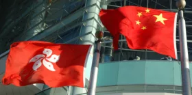 Waving China and Hong Kong flags
