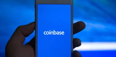 Coinbase - Buy Bitcoin and More, Secure Wallet mobile app on the display of smartphone