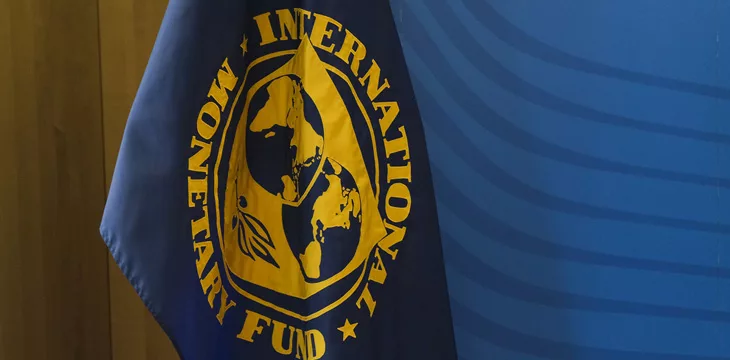 Flag of International Monetary Fund stands in European Commission Headquarters