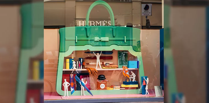 Hermes fashion boutique house decoration of the showcase with multiple characters in a purse design