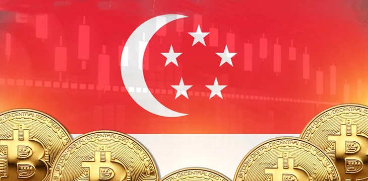 Lot of Bitcoins in front and Singapore flag