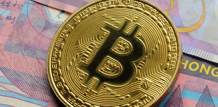 gold bitcoin on top of hong kong dollars