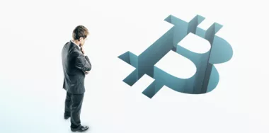 young businessman looking at abstract bitcoin gap on white background. Money concept