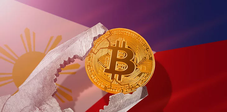 bitcoin being squeezed in vice on Philippines flag background