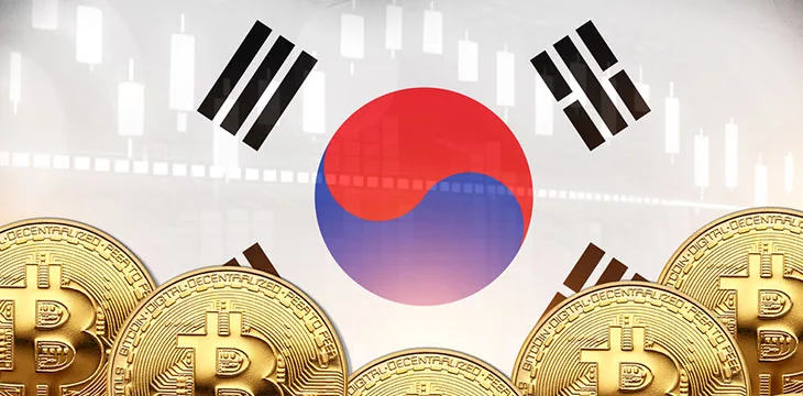 Lot of Bitcoins in front and South Korea flag in wall
