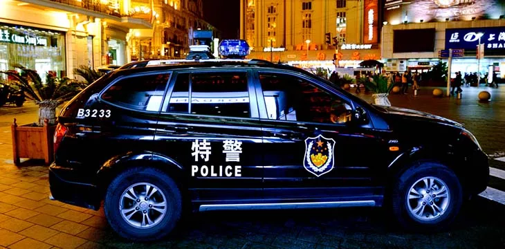 Chinese police car guarding Nanjing Road in Shanghai, China