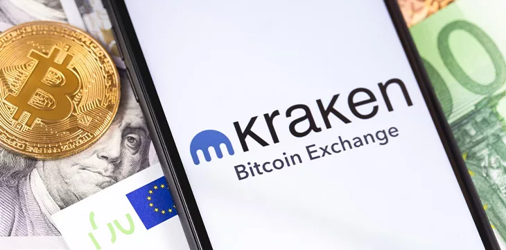 Bitcoin, dollars, euro banknotes and Kraken logo