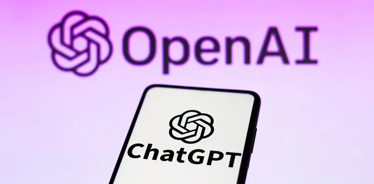 the ChatGPT logo is seen displayed on a smartphone and background the OpenAI company logo