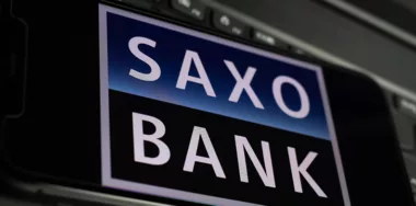 Saxo Bank logo on a smartphone screen