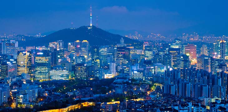 Seoul downtown cityscape illuminated with lights and Namsan Seoul Tower in the evening view from Inwang mountain