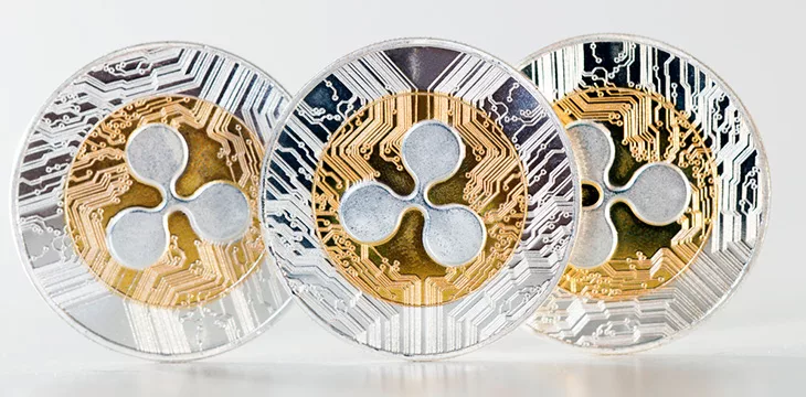 Shiny ripple coins on a white background