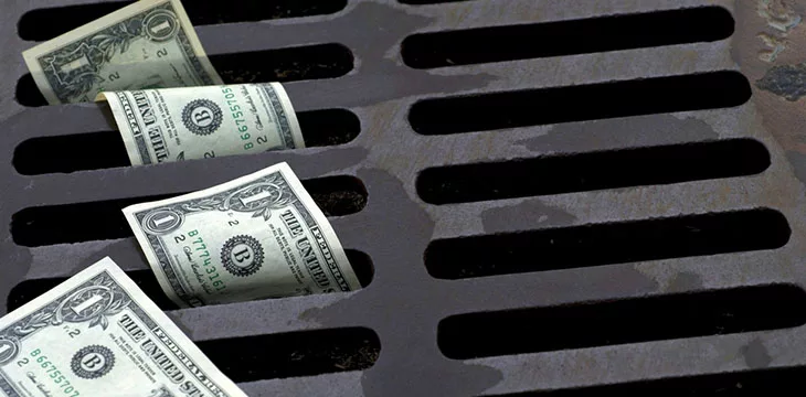 One Dollar bills down the drain