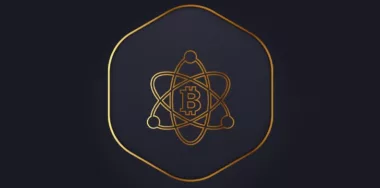 Bitcoin logo with gold outlines and atomic concept design