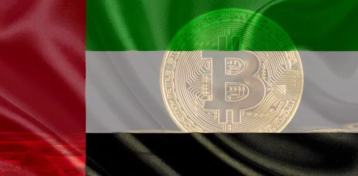 Gold bitcoin at the back of UAE flag