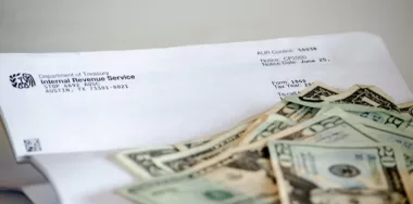 IRS letter with dollar bills on top