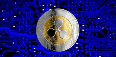 Ripple coin with background of blue circuit board