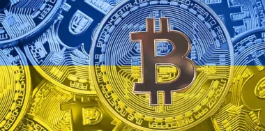 Stack of Bitcoin and Ukraine flag