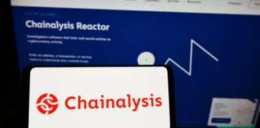 Chainalysis logo on phone and desktop screen