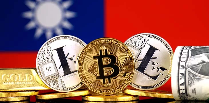 physical version of bitcoin and litecoins in front of Taiwan flag
