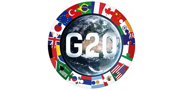 Group of 20 text with member nation flags and globe icon