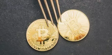 Golden bitcoin and Bitcoin cash under a fork concept image for a bitcoin fork