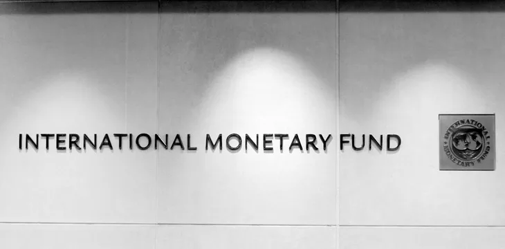 International Monetary Fund displayed on concrete wall