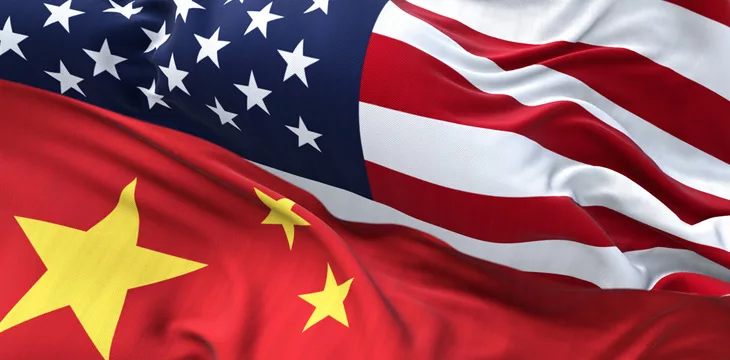 The flags of China and the United States of America waving, concept of international relations and diplomacy