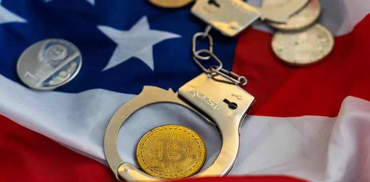 Golden Bitcoins Cryptocurrency with Handcuffs on Dollar bills