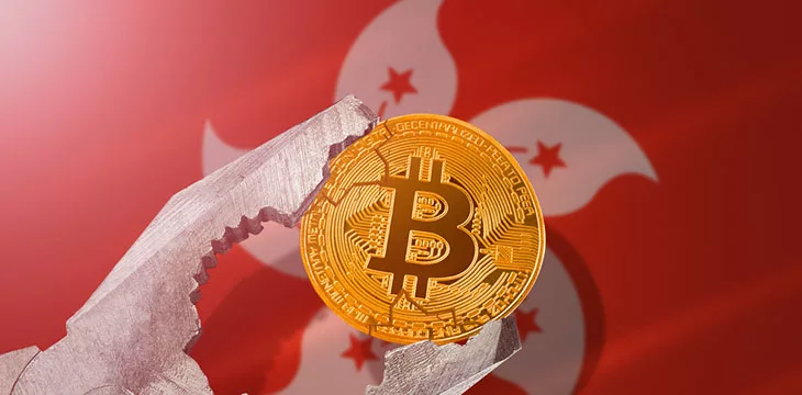 Vice holding a bitcoin in front of Hong Kong flag