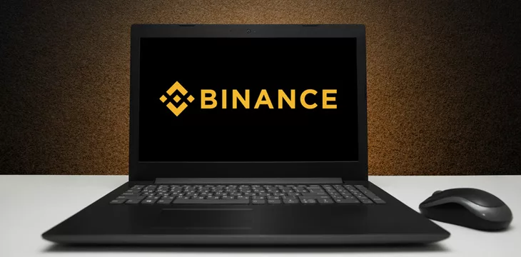 Laptop displaying logo of Binance