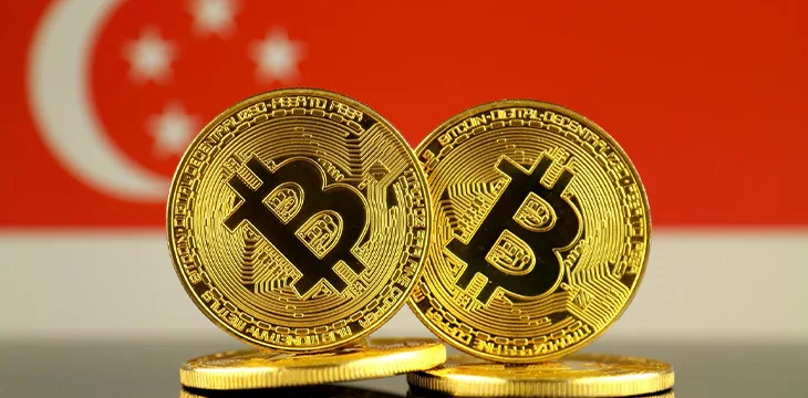Bitcoin with Singapore flag in the background