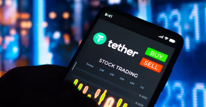 Stock trading graph of Tether (USDT) seen on a smartphone screen