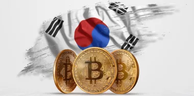 3 gold bitcoins in front of South Korean flag