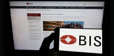 BIS logo visible on smartphone screen with website page