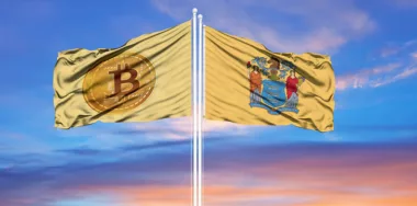 Bitcoin and New Jersey flags on flagpoles