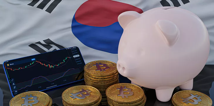 Bitcoin and cryptocurrency investing. South Korea flag in background. Piggy bank, the of saving concept. Mobile application for trading on stock. 3d render illustration