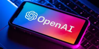 OpenAI logo on a phone screen