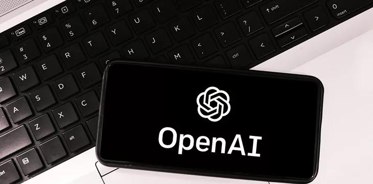 OpenAI logo on phone screen