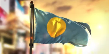 Palau Flag Against City Blurred Background