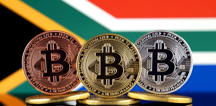 Physical version of Bitcoin (BTC) and South Africa Flag