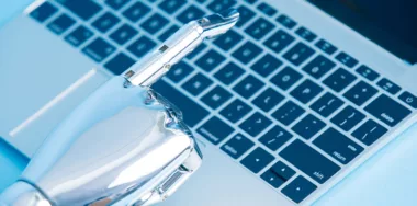 Robot hand using laptop
