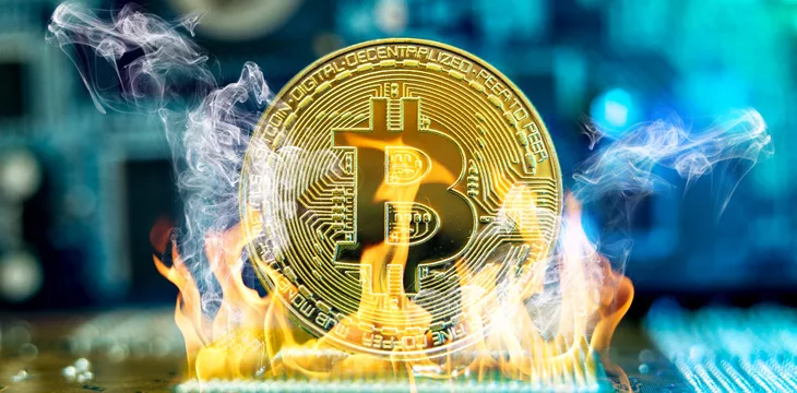 Bitcoin cryptocurrency in the form of a coin burns