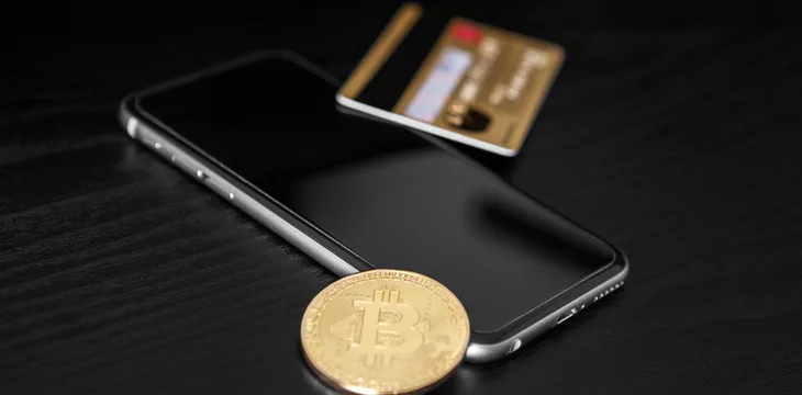 Credit card, bitcoin, smartphone on the table