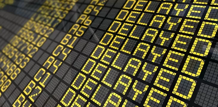 International Airport Board Close-Up with Delayed