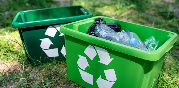 Green recycling boxes with plastic trash