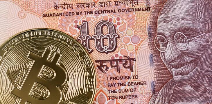 A golden bitcoin with an orange 10 Indian rupee