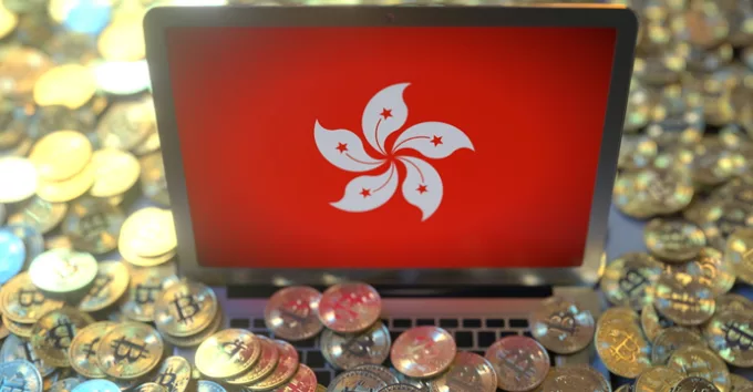 Flag on the laptop screen and many bitcoins