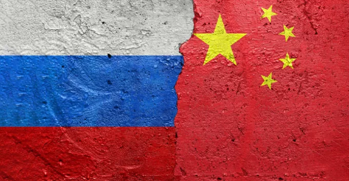 Russia and China flags on concrete