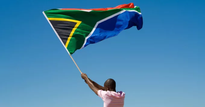 A man waving South Africa flag